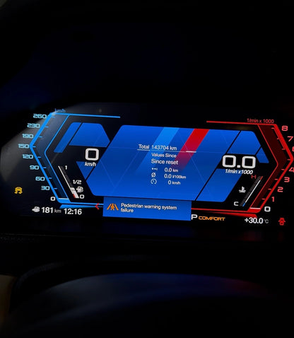 BMW digital instrument cluster showing warning messages, mileage, trip data, speed and RPM information