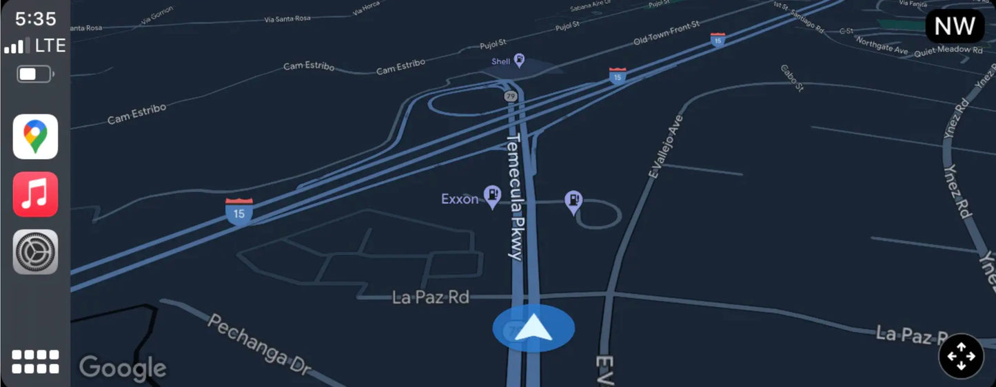 BMW infotainment screen with Apple CarPlay showing Google Maps navigation and live route guidance