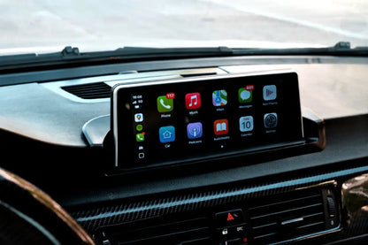 BMW dashboard infotainment screen upgrade installed with Apple CarPlay interface and OEM-style wide display