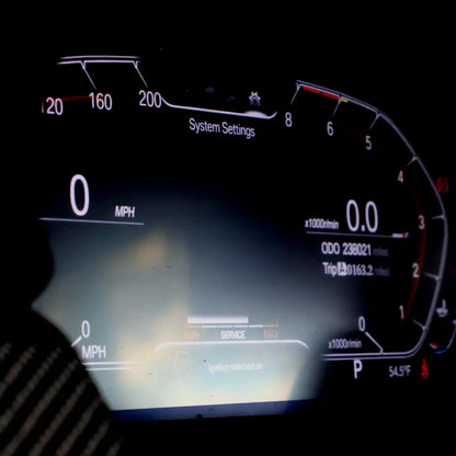 BMW digital cluster upgrade showing clean OEM-style LCD dashboard with system settings and driving data
