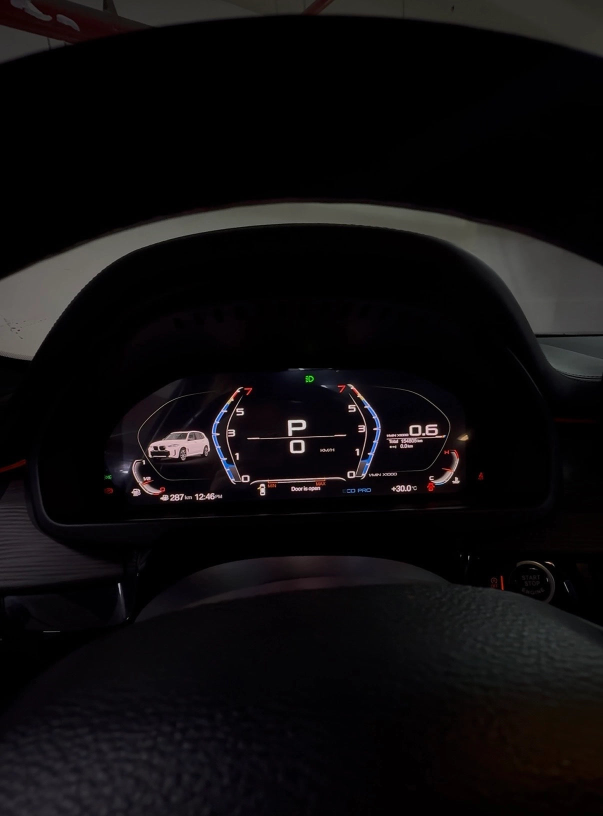 BMW digital instrument cluster shown from the driver view with vehicle visualization, speed, RPM and live driving data