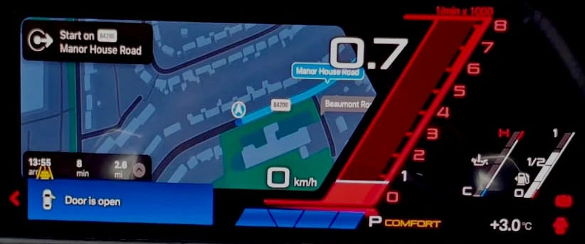 a close-up view on a bmw digital cluster upgrade with carplay maps integration