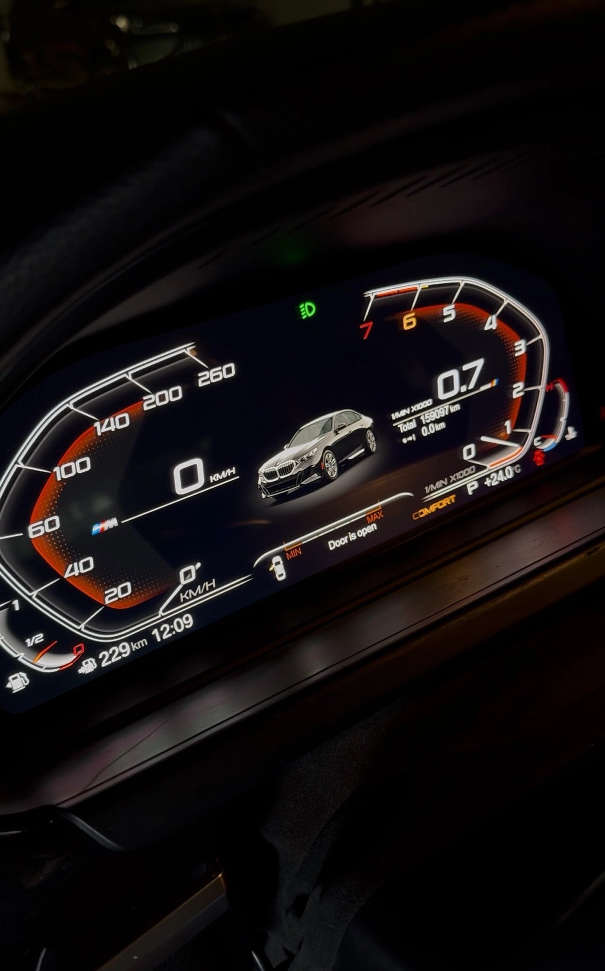 BMW digital instrument cluster installed with vehicle visualization, speed, RPM and door status display