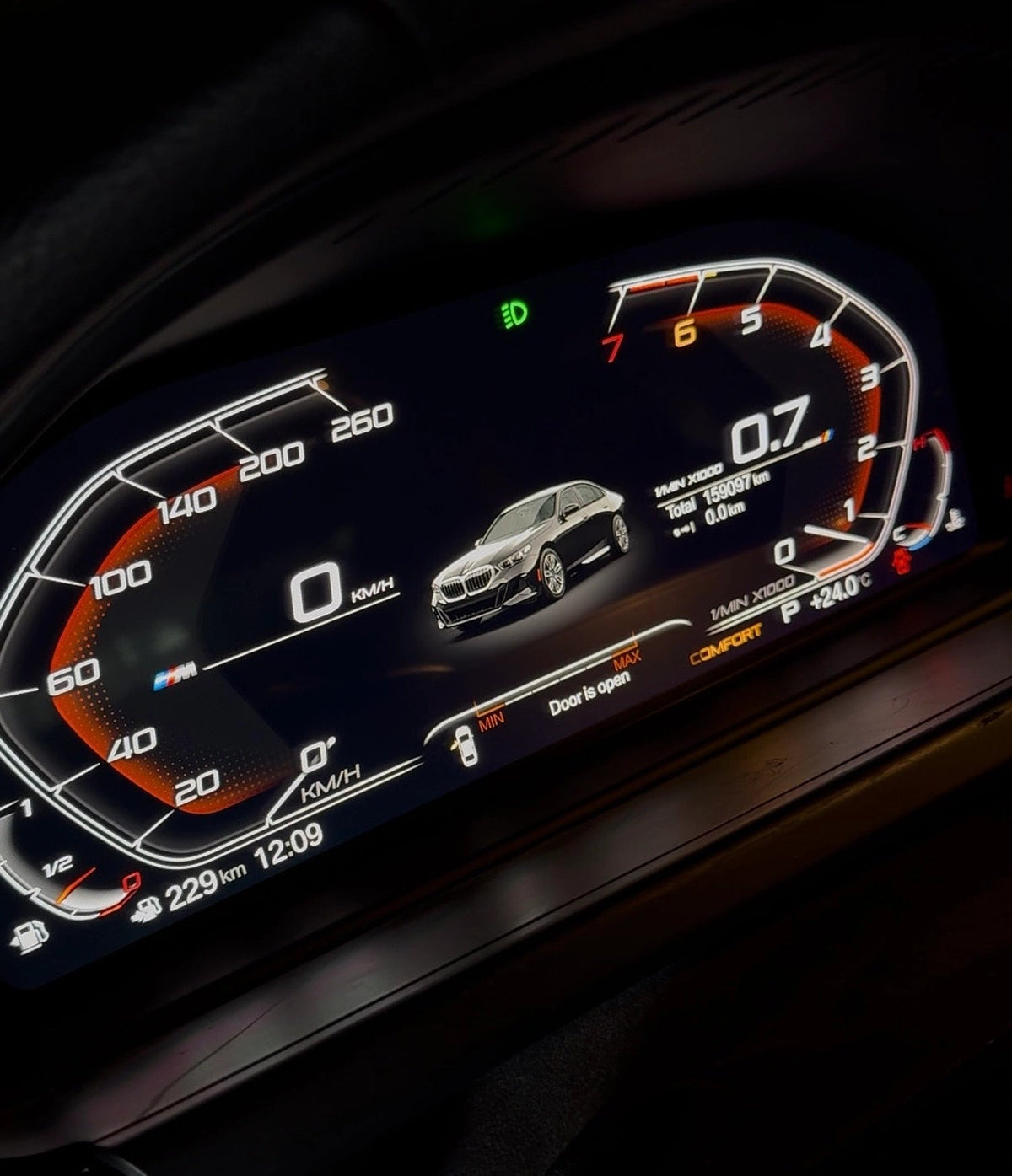 BMW digital instrument cluster installed with vehicle visualization, speed, RPM and door status display