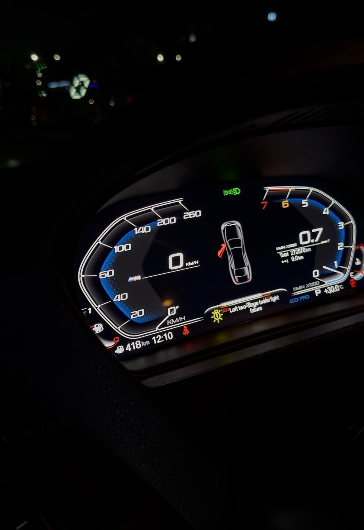 BMW digital instrument cluster displaying vehicle status, warning messages, open door indicator and live driving information