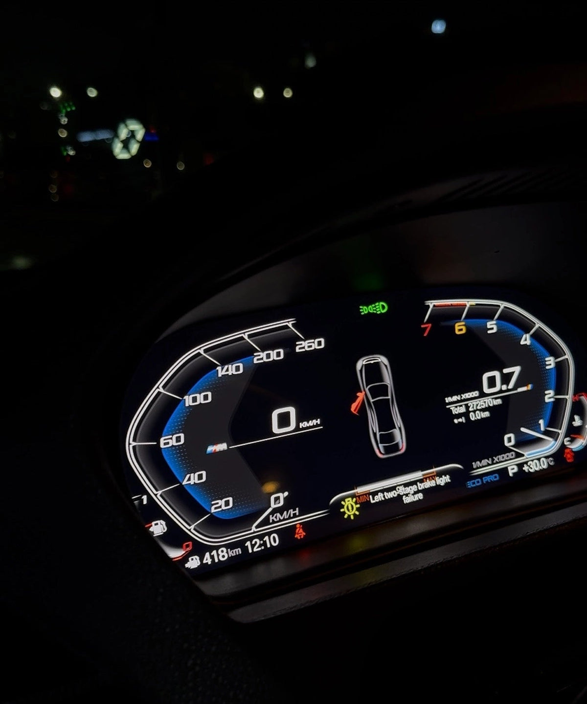 BMW digital instrument cluster displaying vehicle status, warning messages, open door indicator and live driving information