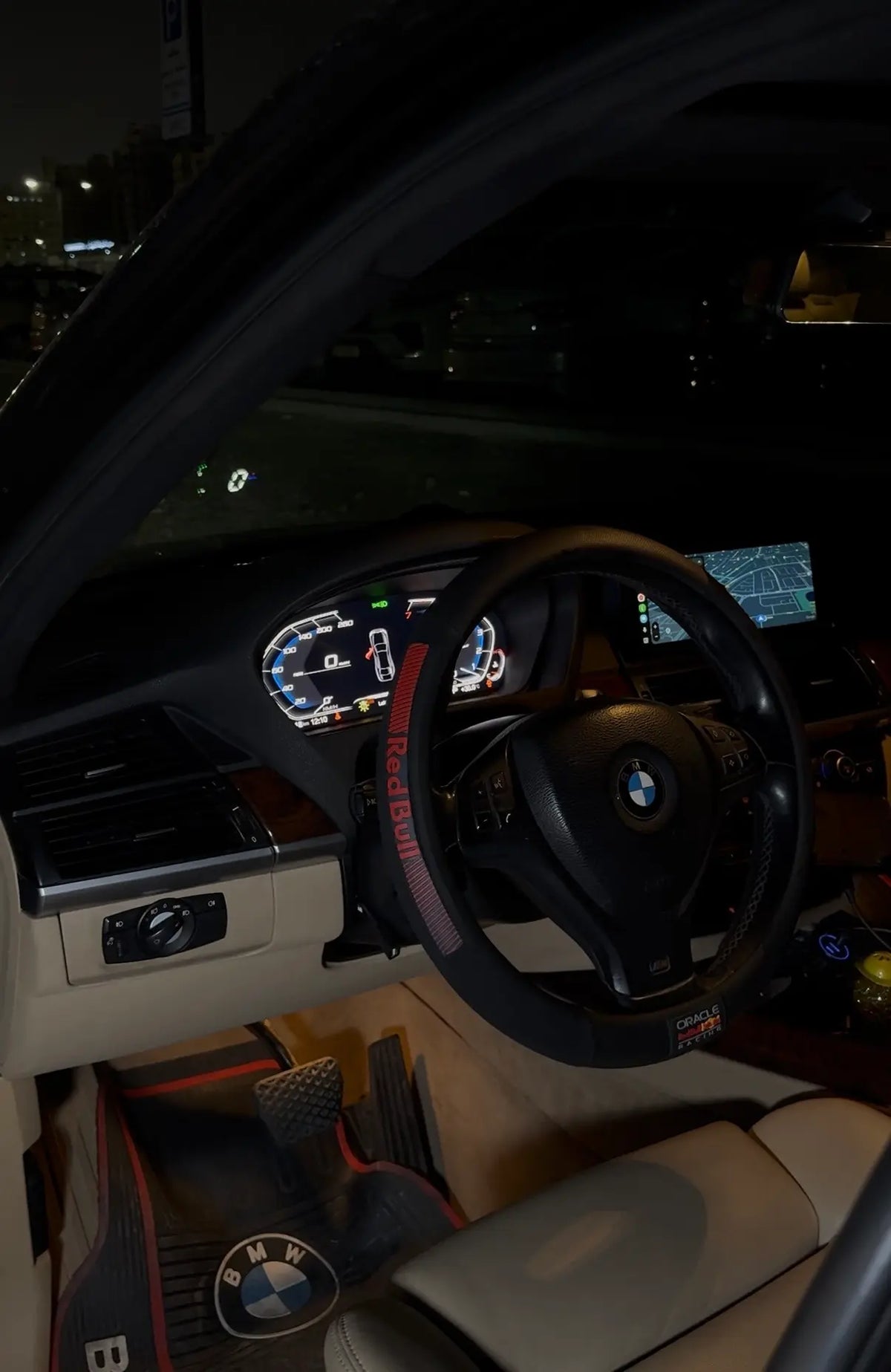 A black Bmw e70 with a digital cockpit retrofitted by BimmerBunny