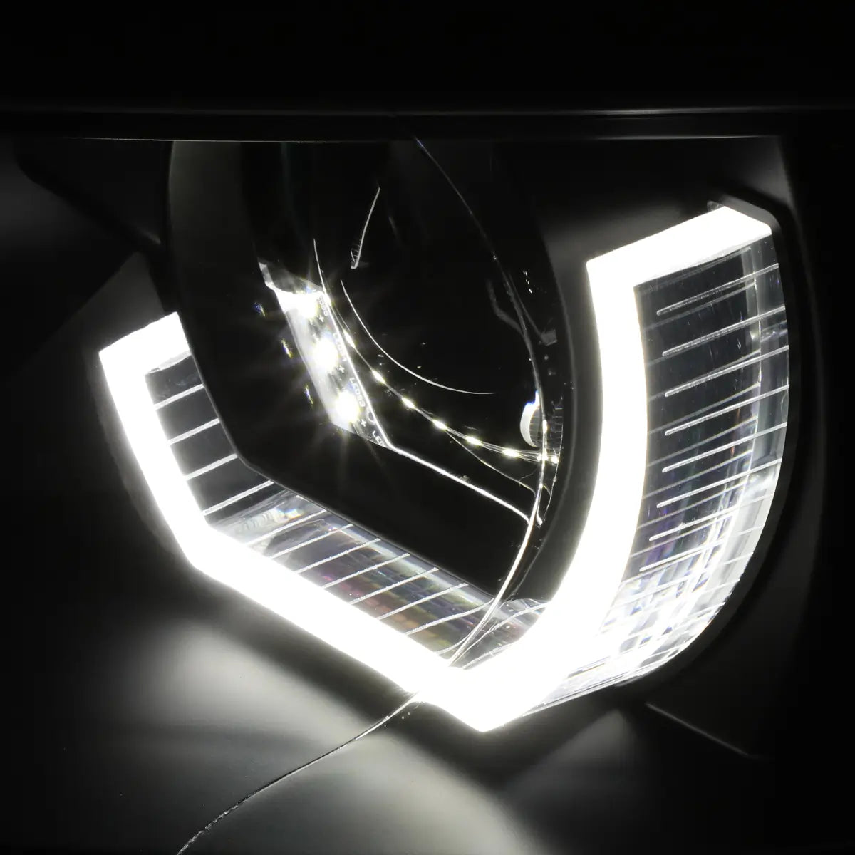 Close-up of BMW E92 E93 headlight with illuminated 3D crystal U-halo LED daytime running light