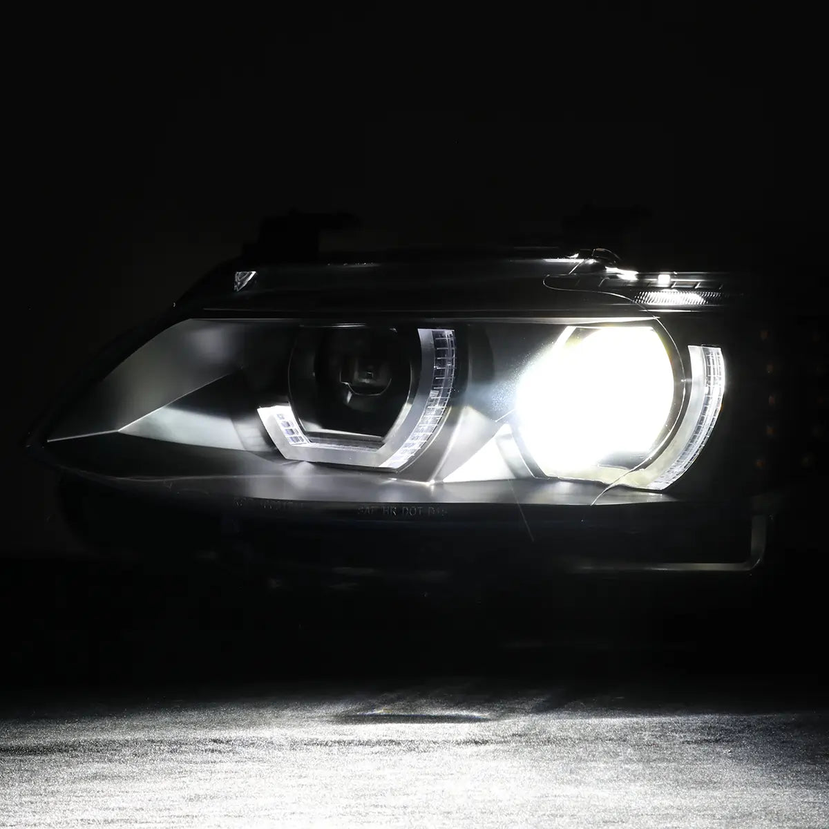 BMW E92 E93 LED headlight illuminated at night with white 3D crystal DRL and bright projector beam