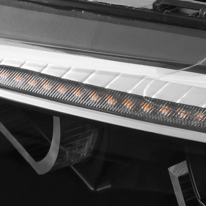Close-up of BMW E92 E93 LED headlight showing the upper sequential turn signal light bar above the 3D crystal DRL