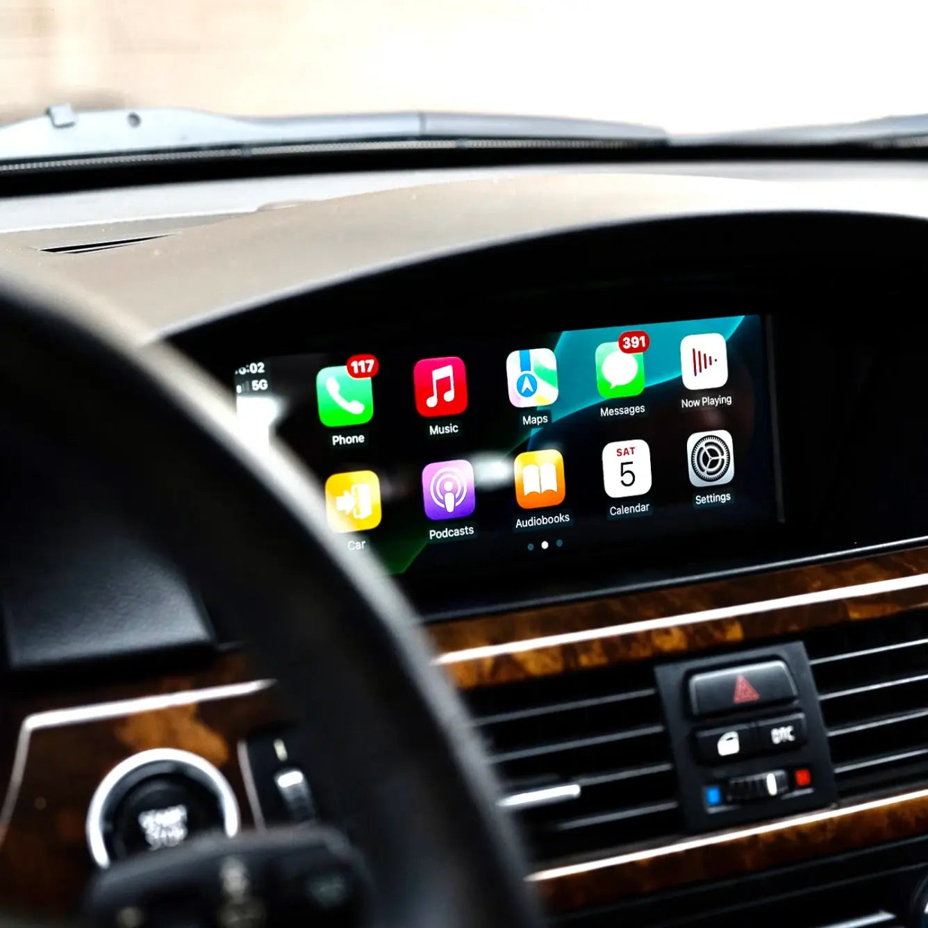 OEM-style infotainment screen with Apple CarPlay and Android Auto installed in BMW E9X dashboard (E90 E91 E92 E93)