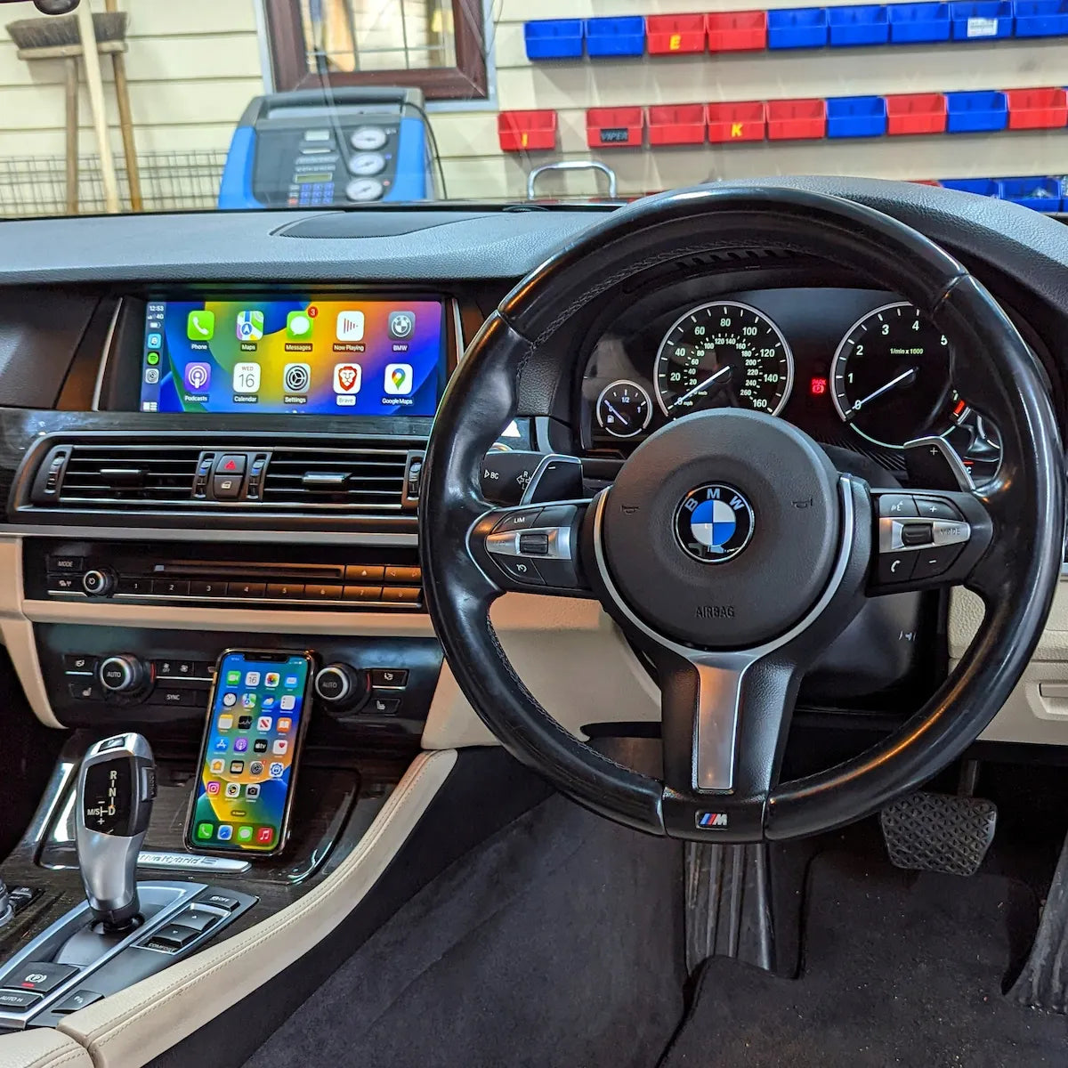 BMW F10 and F01 interior after installation of a 10.25-inch OEM-style Android touchscreen with Apple CarPlay