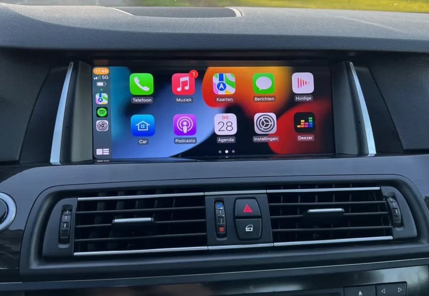 Apple CarPlay screen replacement installed in BMW 5 Series F10 / F11 and BMW 7 Series F01 / F02 with OEM-style dashboard integration