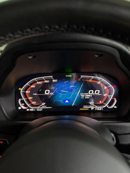 Close-up of a BMW's digital instrument cluster display showing a blue and red dashboard interface with carplay maps, framed by a dark leather steering wheel and dashboard.