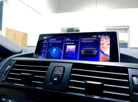 BMW infotainment display showing OEM-style interface with navigation, music and vehicle information menu