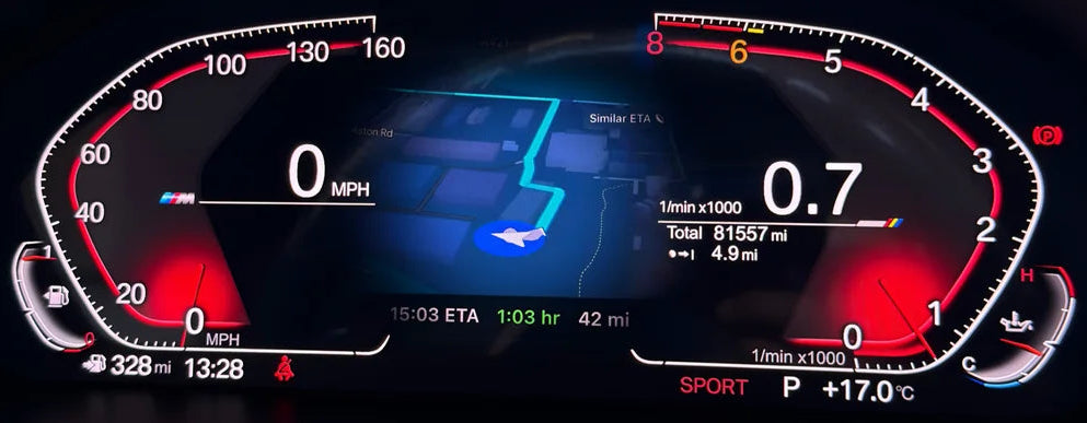 A close-up of a bmw digital instrument cluster display showing a dark dashboard interface with red, white, and blue illuminated graphics and speedometer/tachometer markings as well as apple maps integration.