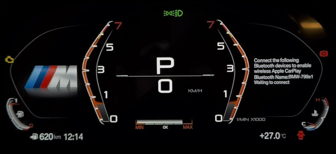 A close-up of a BMW's digital instrument cluster display, showing a black screen with illuminated orange and white graphics, a central 'P 0' speedometer readout, and the BMW M logo on the left side.