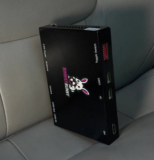BimmerBunny BMW wireless CarPlay and Android Auto MMI box showing HDMI, UART, toggle switch, CAN power and LVDS ports
